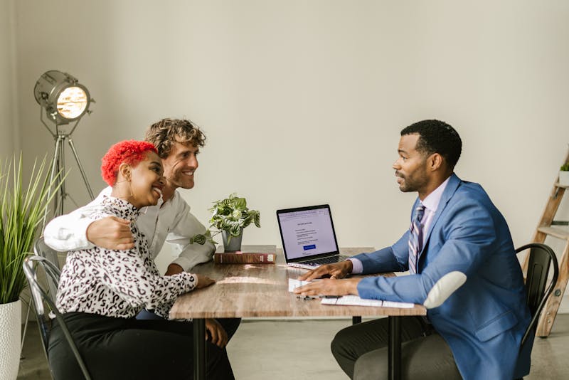 a couple talking to a financial advisor